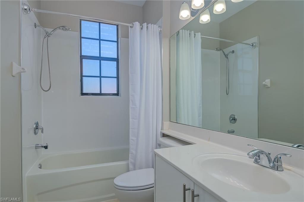 7658 Bristol Circle Naples, FL 34120 - Photo 19 of 32 a bathroom with a sink toilet and shower
