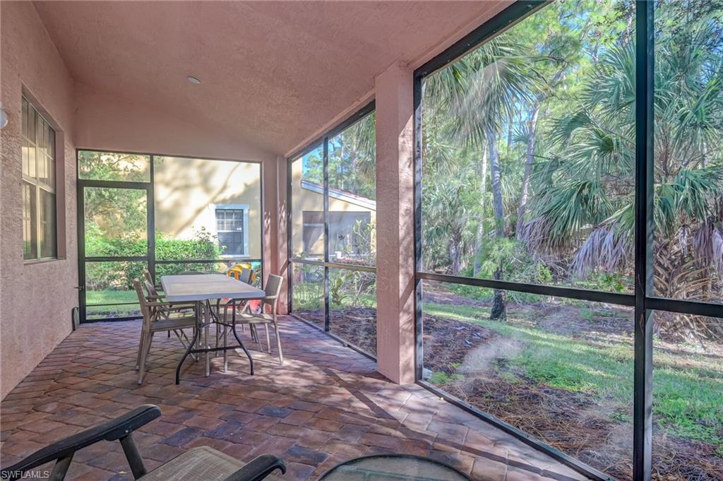 7658 Bristol Circle Naples, FL 34120 - Photo 22 of 32 a view of a yard with a porch