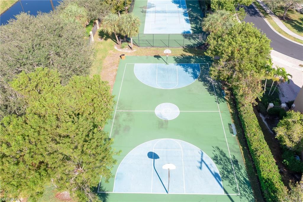 7658 Bristol Circle Naples, FL 34120 - Photo 28 of 32 a view of a bathroom with a sink and a pathway