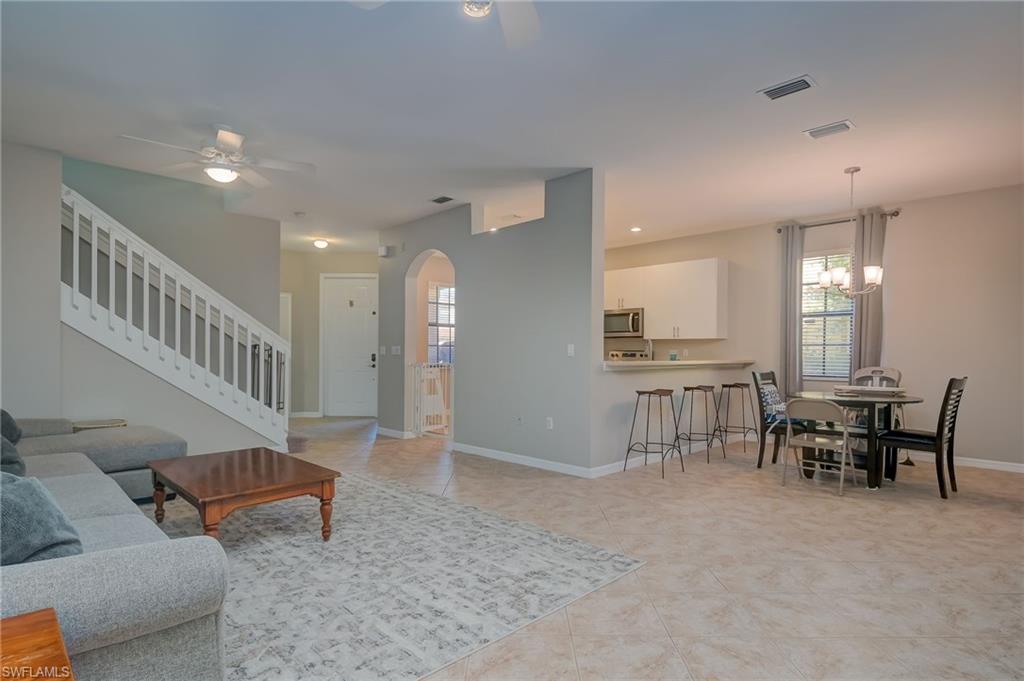 7658 Bristol Circle Naples, FL 34120 - Photo 6 of 32 a view of a livingroom with furniture and windows