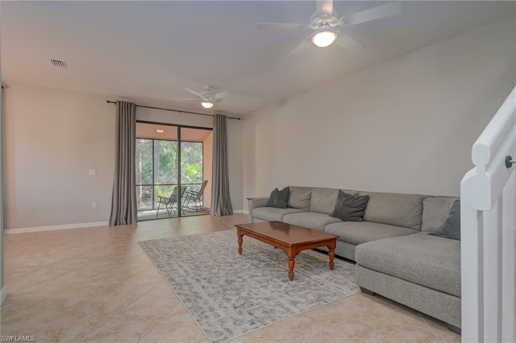 7658 Bristol Circle Naples, FL 34120 - Photo 8 of 32 a living room with furniture and a couch