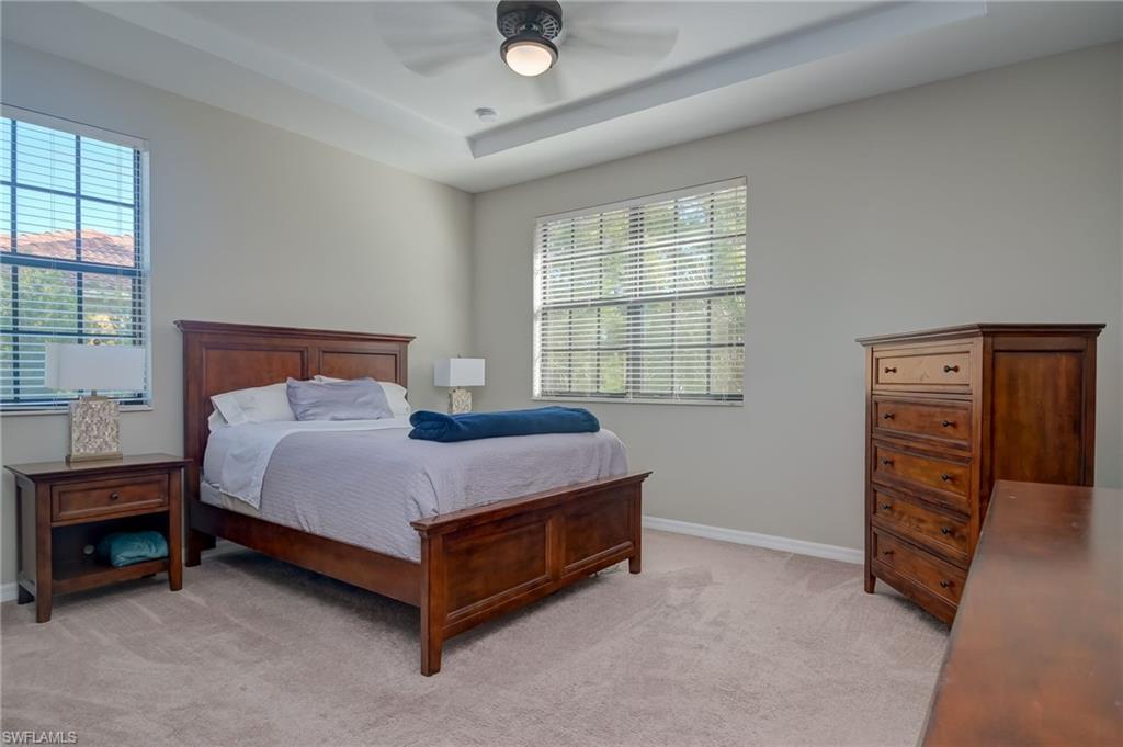 7658 Bristol Circle Naples, FL 34120 - Photo 10 of 32 a bedroom with a bed and a closet