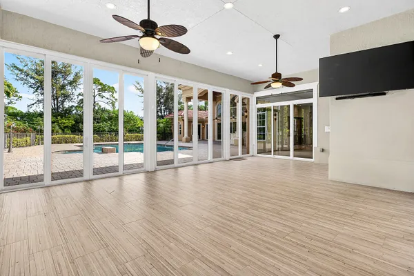 a view of a room with wooden floor