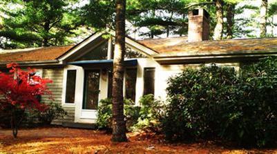 108 Pine Ridge Road Cotuit, MA 02635 - Photo 3 of 18 a front view of a house with garden