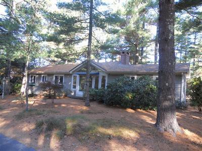 108 Pine Ridge Road Cotuit, MA 02635 - Photo 5 of 18 a front view of a house with garden