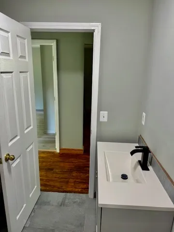 a bathroom with a sink and mirror