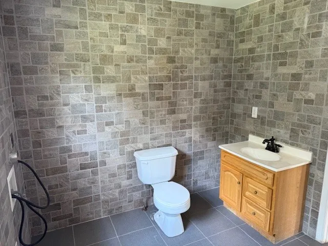 a bathroom with a toilet and a sink