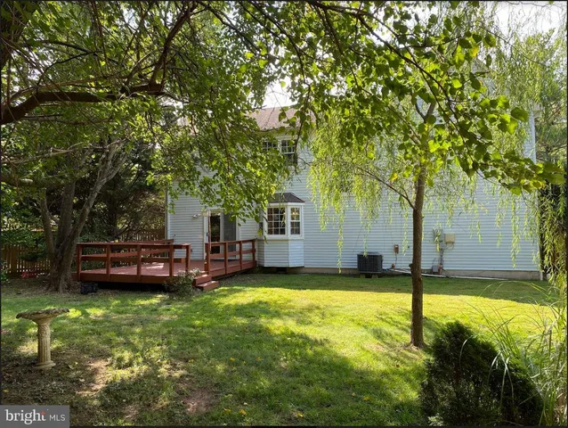 a view of a swimming pool with a yard