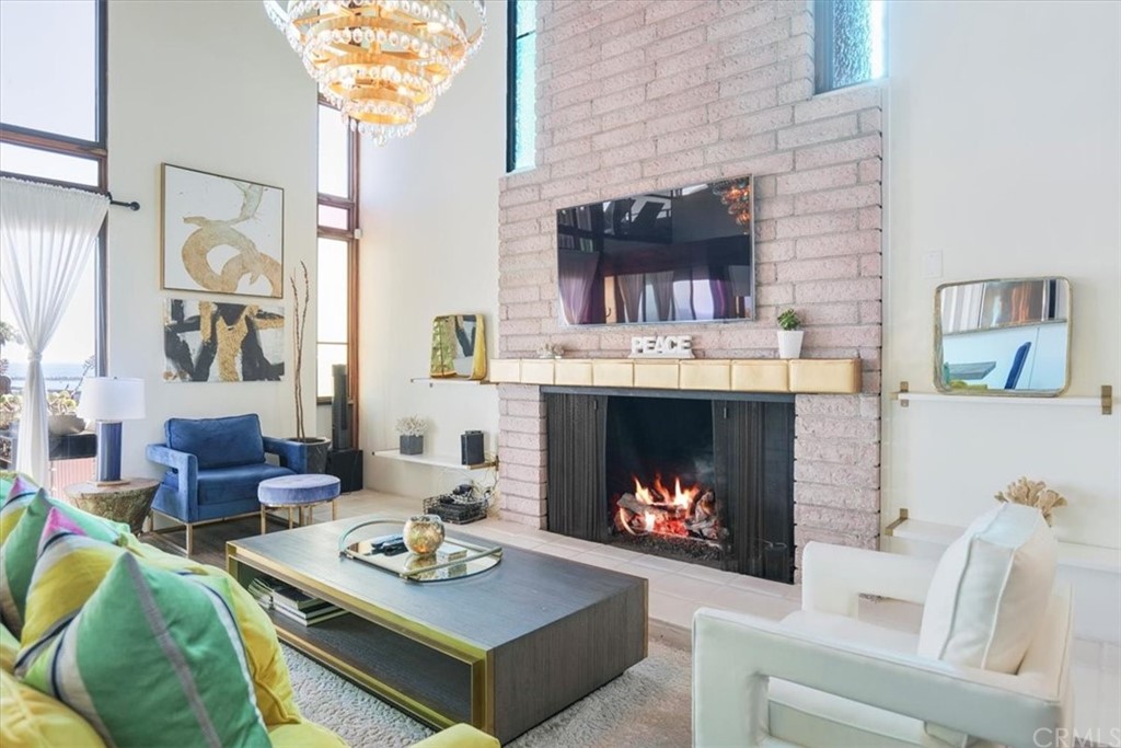 3047 Ocean Boulevard Corona del Mar, CA 92625 - Photo 22 of 53 a living room with furniture and a fireplace