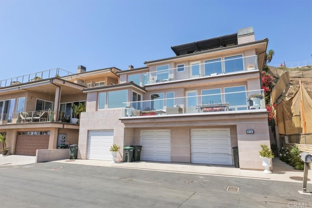 3047 Ocean Boulevard Corona del Mar, CA 92625 - Photo 31 of 53 a front view of a house with yard