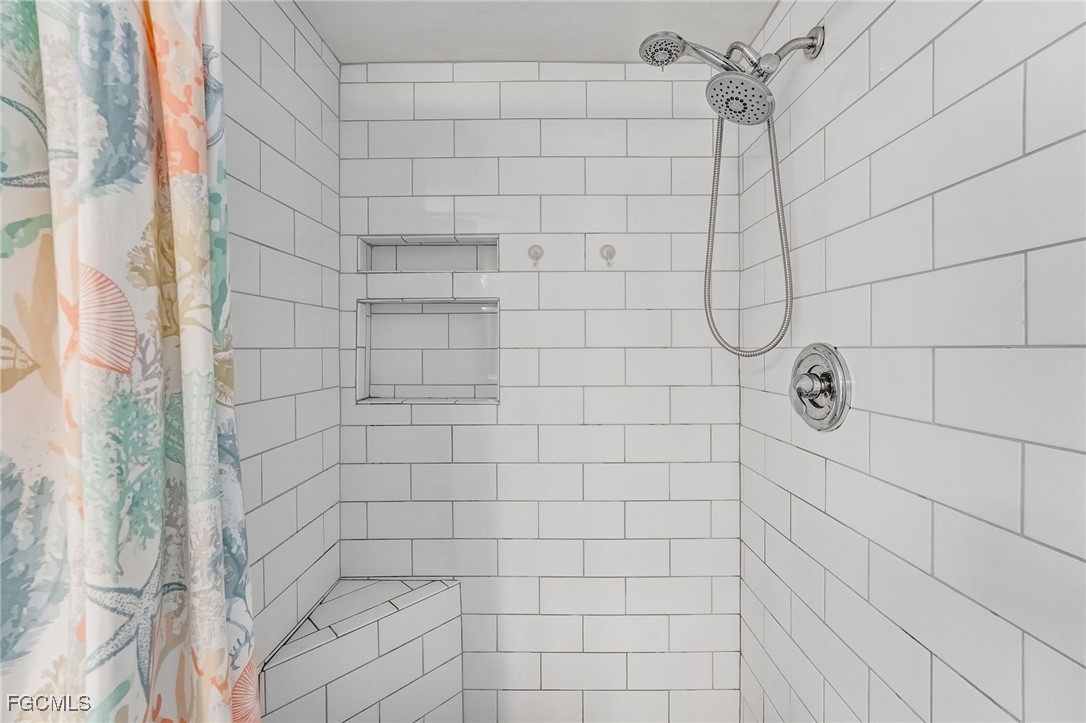 16007 Davis Road, Unit 524 Fort Myers, FL 33908 - Photo 17 of 36 a bathroom with a shower