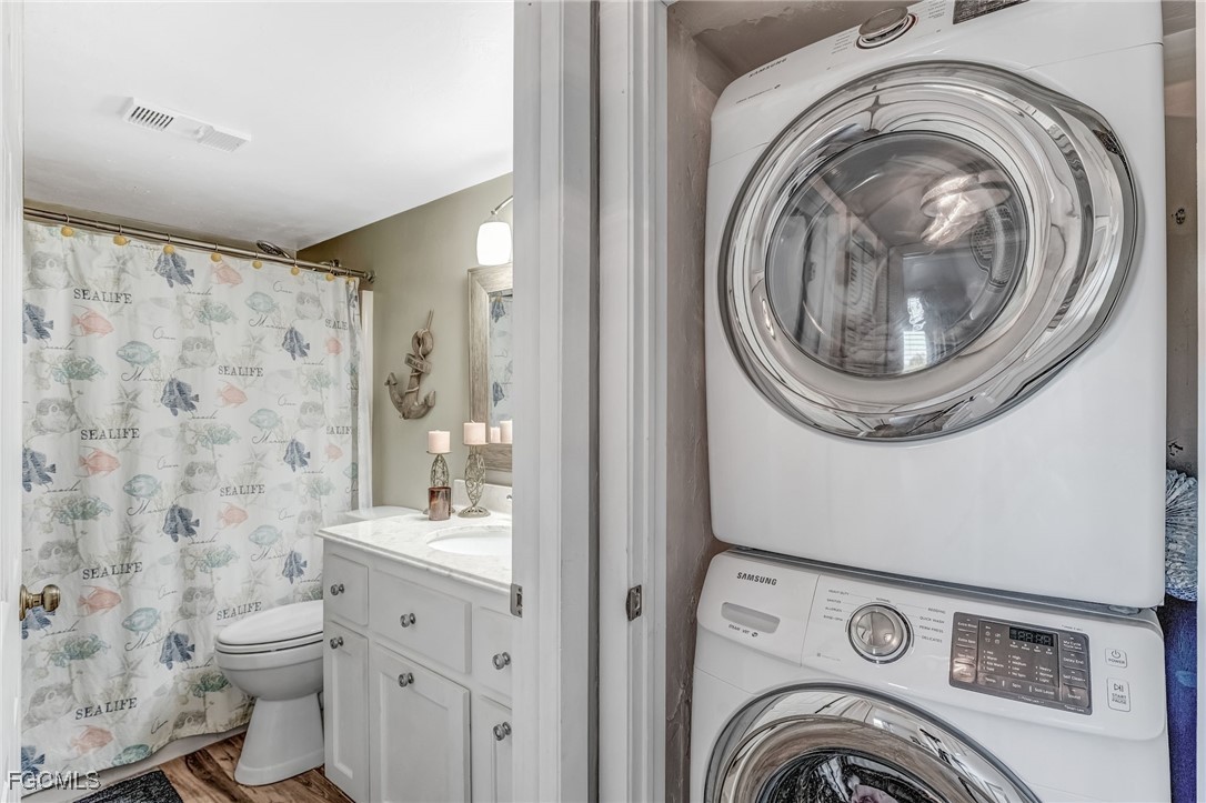 16007 Davis Road, Unit 524 Fort Myers, FL 33908 - Photo 20 of 36 a view of bathroom with washing machine