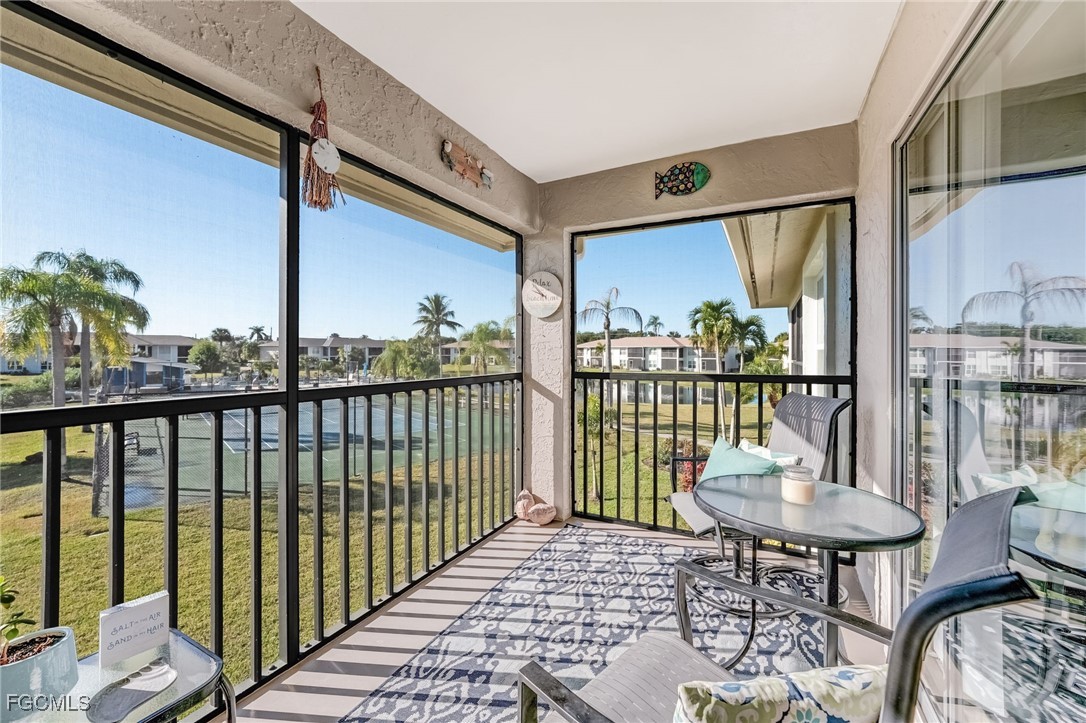 16007 Davis Road, Unit 524 Fort Myers, FL 33908 - Photo 21 of 36 a view of a balcony with chairs
