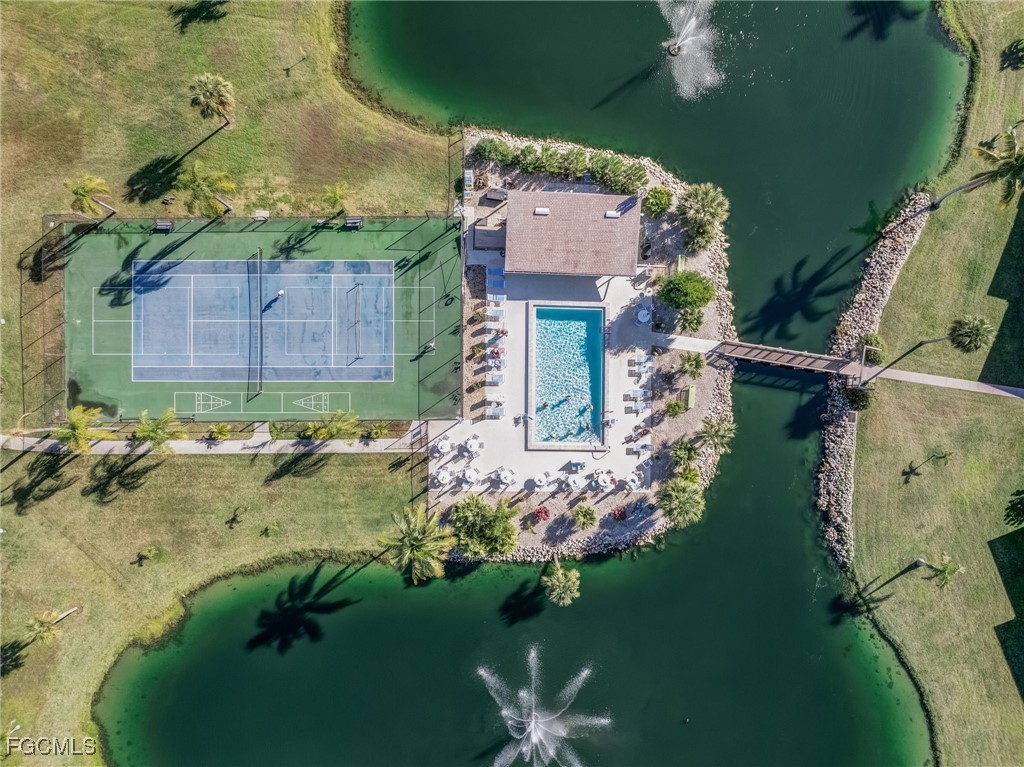 16007 Davis Road, Unit 524 Fort Myers, FL 33908 - Photo 24 of 36 an aerial view of a house with a yard basket ball court and outdoor seating