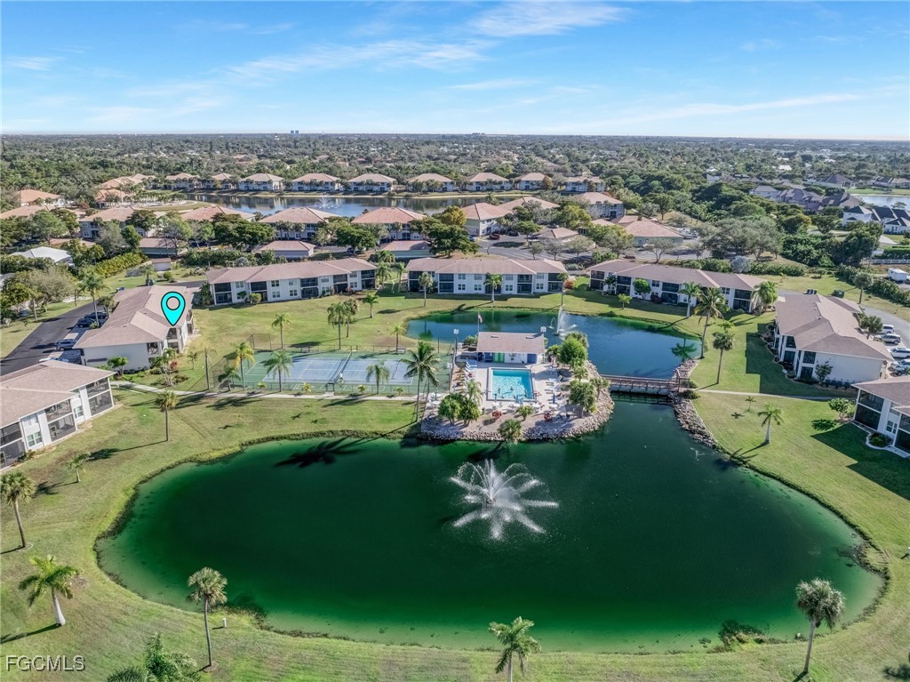 16007 Davis Road, Unit 524 Fort Myers, FL 33908 - Photo 25 of 36 an aerial view of residential houses with outdoor space