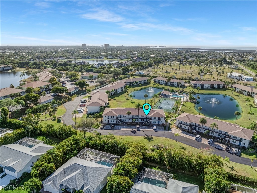16007 Davis Road, Unit 524 Fort Myers, FL 33908 - Photo 29 of 36 an aerial view of a house with a swimming pool outdoor seating and yard