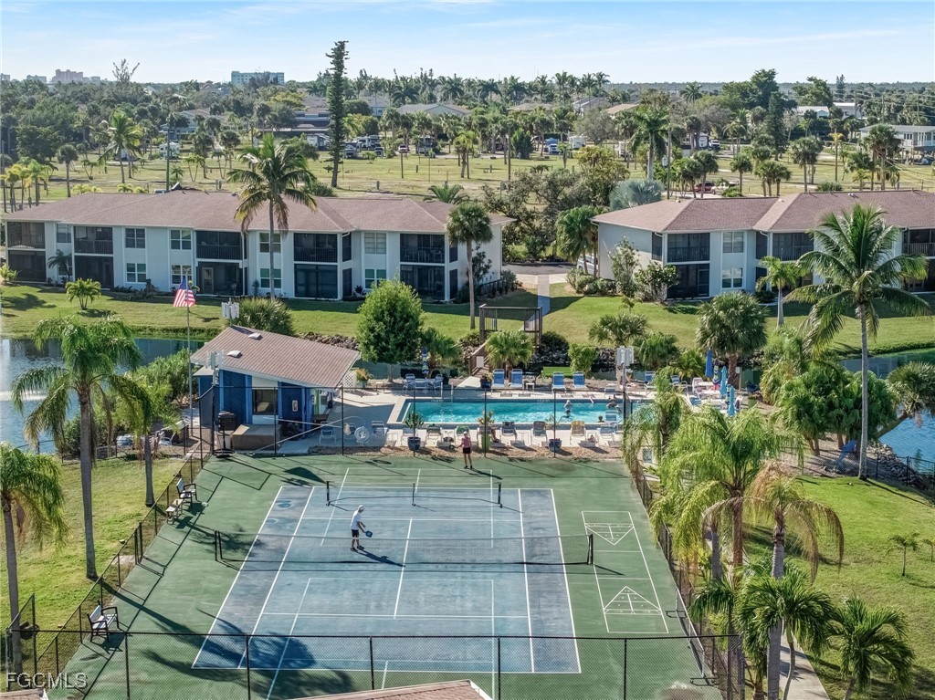 16007 Davis Road, Unit 524 Fort Myers, FL 33908 - Photo 32 of 36 a front view of a house with a garden