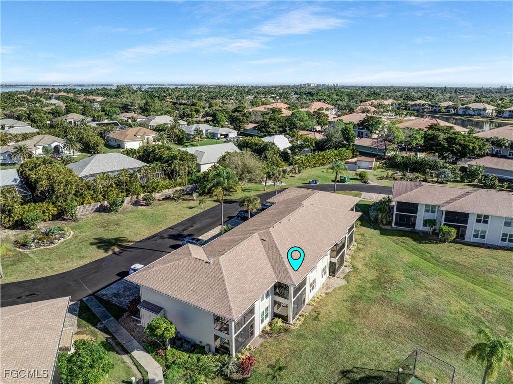 16007 Davis Road, Unit 524 Fort Myers, FL 33908 - Photo 33 of 36 an aerial view of a house with a garden