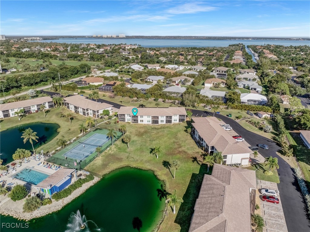 16007 Davis Road, Unit 524 Fort Myers, FL 33908 - Photo 36 of 36 an aerial view of residential houses with outdoor space