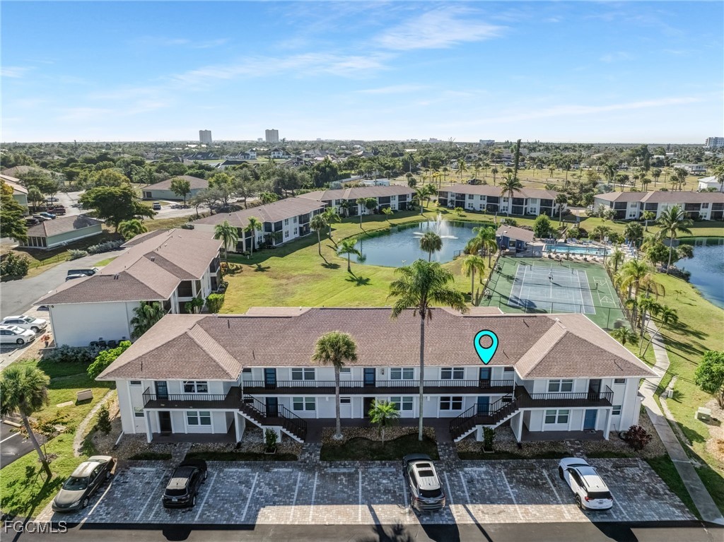 16007 Davis Road, Unit 524 Fort Myers, FL 33908 - Photo 7 of 36 a view of a city with tall buildings