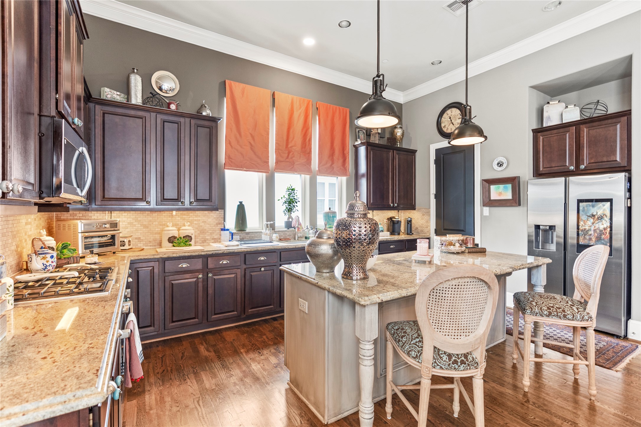 1102 Thompson Street Houston, TX 77007 - Photo 7 of 35 a large kitchen with granite countertop a sink stove and cabinets
