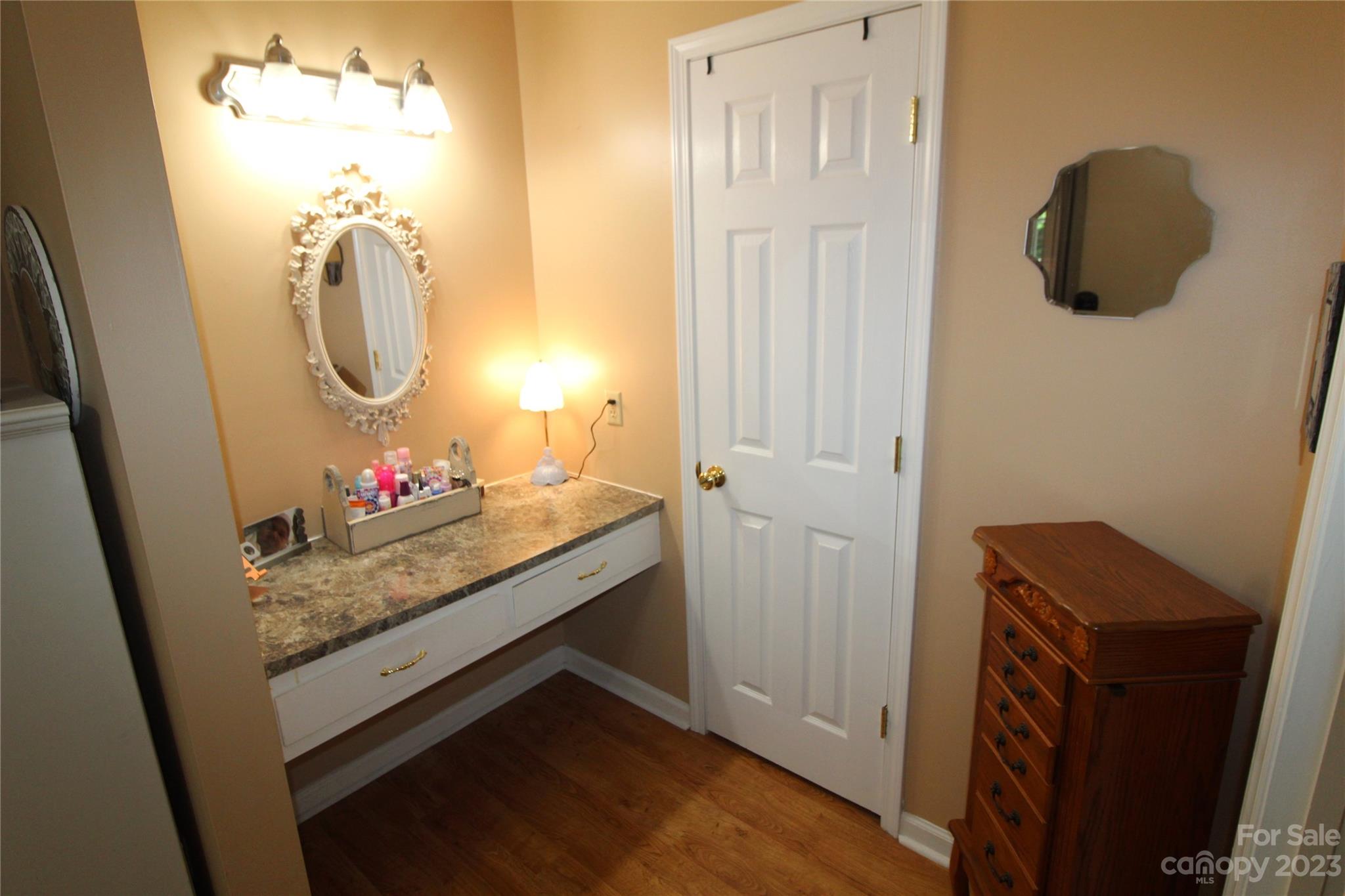 104 McCall Street Clover, SC 29710 - Photo 11 of 22 a bathroom with a sink a mirror and vanity
