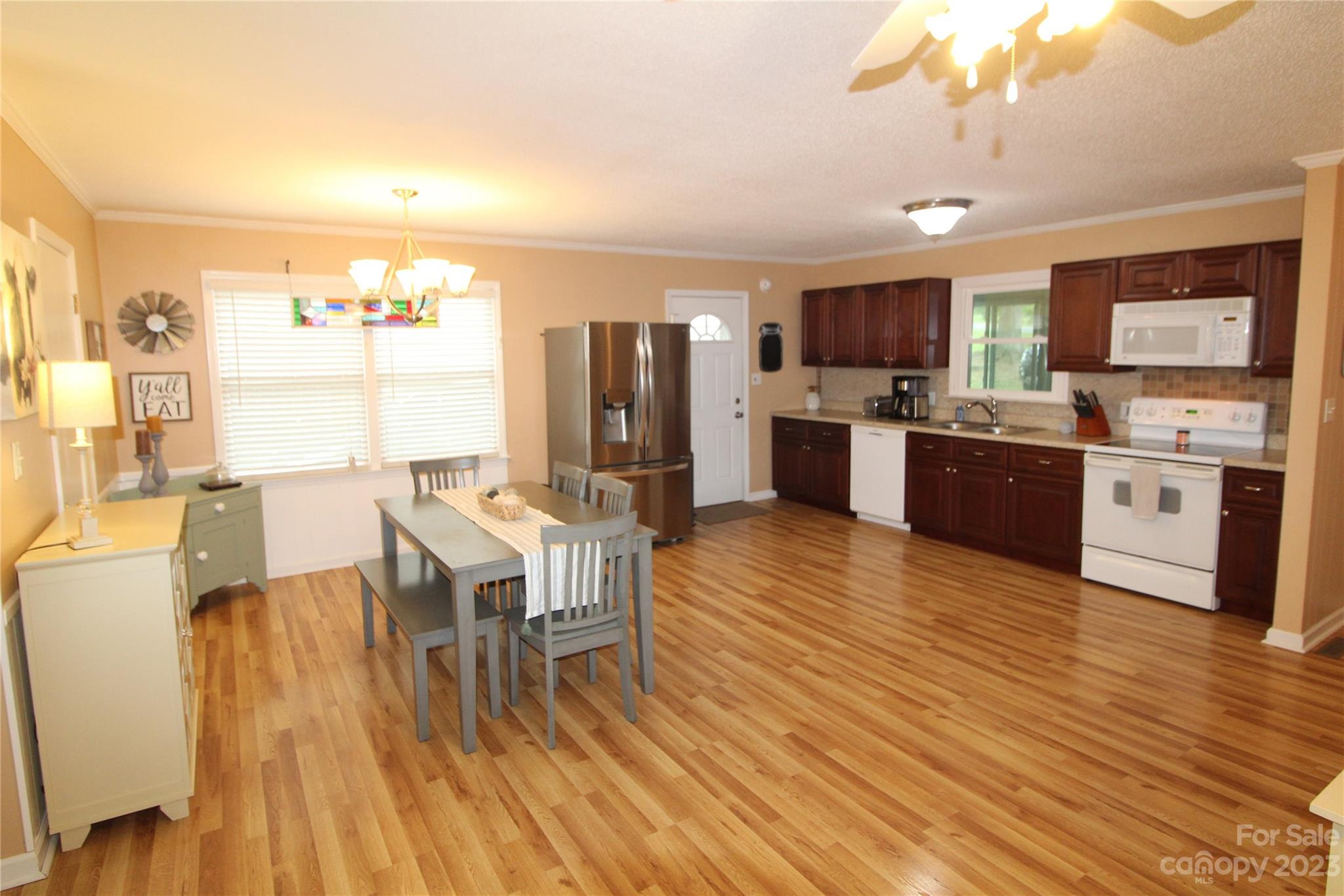 104 McCall Street Clover, SC 29710 - Photo 2 of 22 a large kitchen with a table and chairs in it