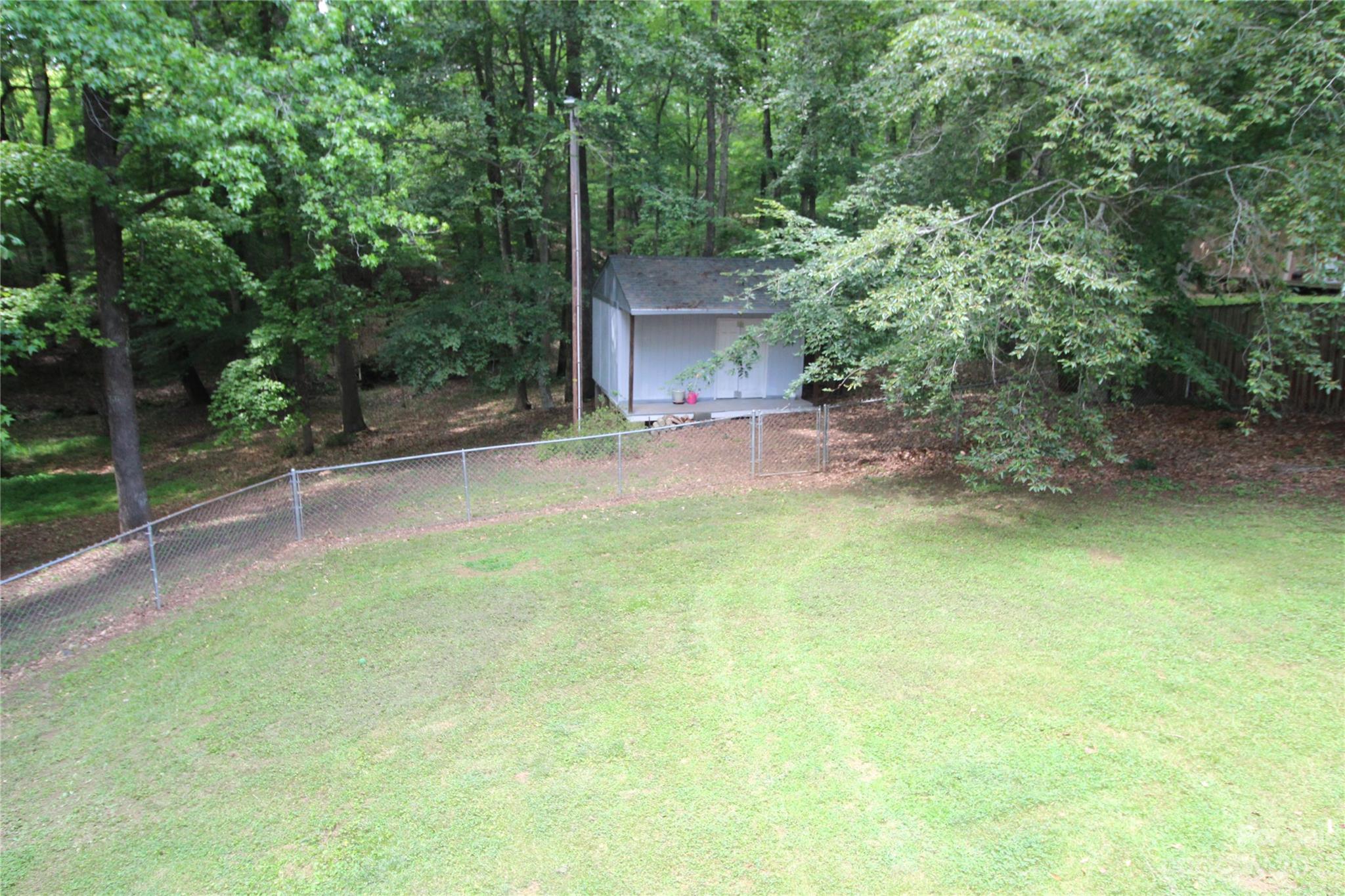 104 McCall Street Clover, SC 29710 - Photo 21 of 22 front view of a house with a yard