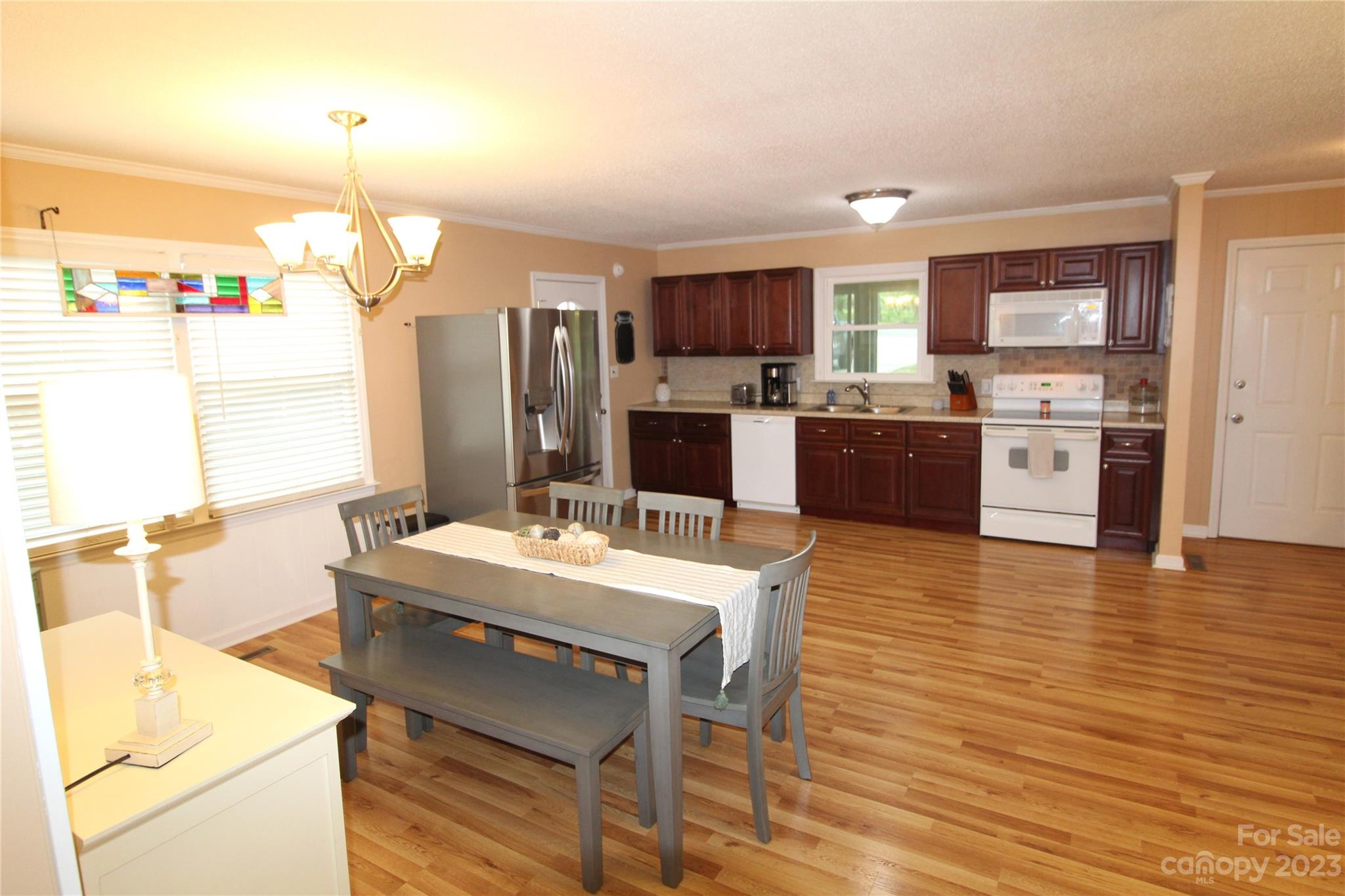 104 McCall Street Clover, SC 29710 - Photo 3 of 22 a large kitchen with a table and chairs in it