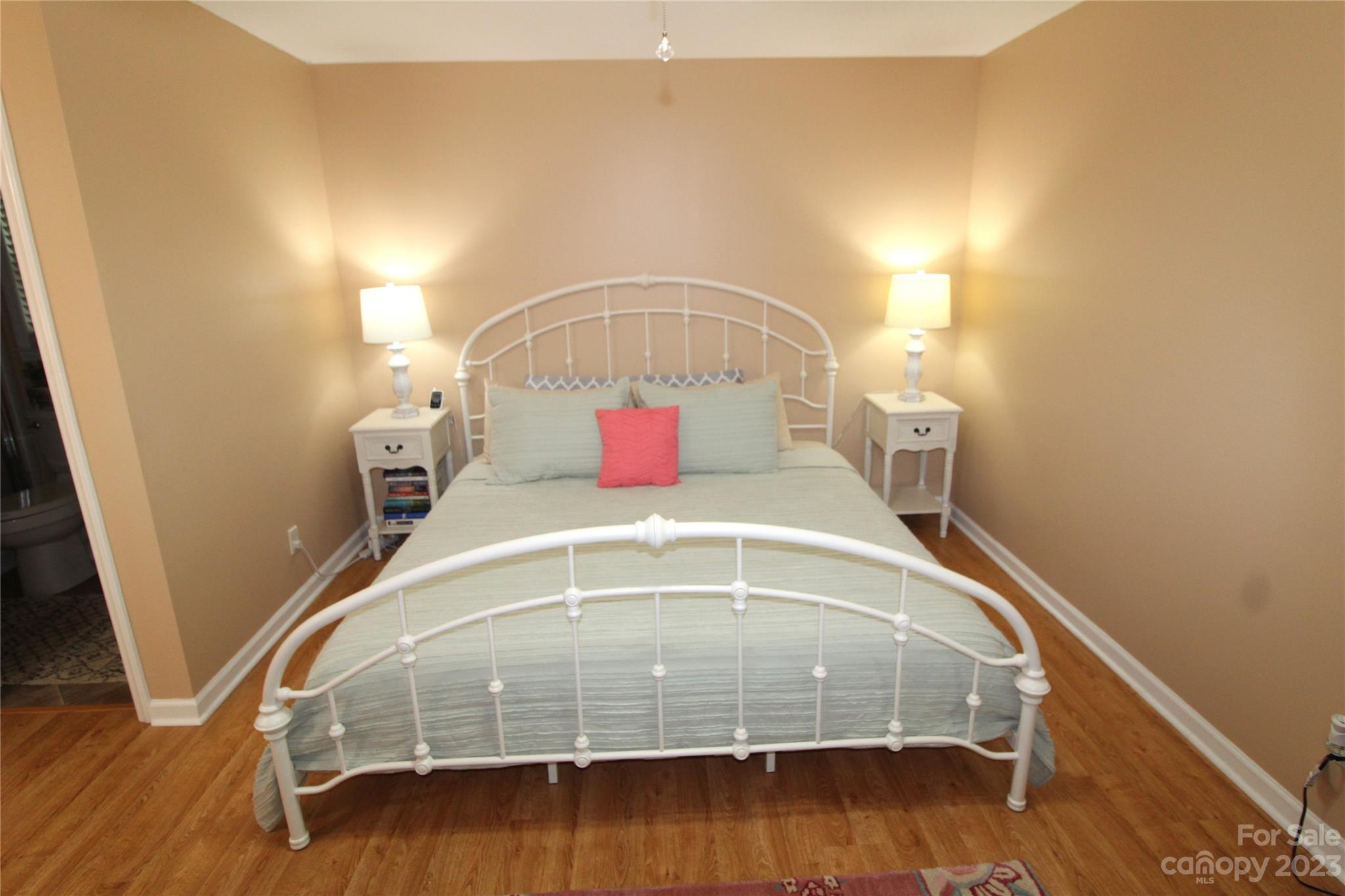 104 McCall Street Clover, SC 29710 - Photo 9 of 22 a bedroom with a bed and wooden floor