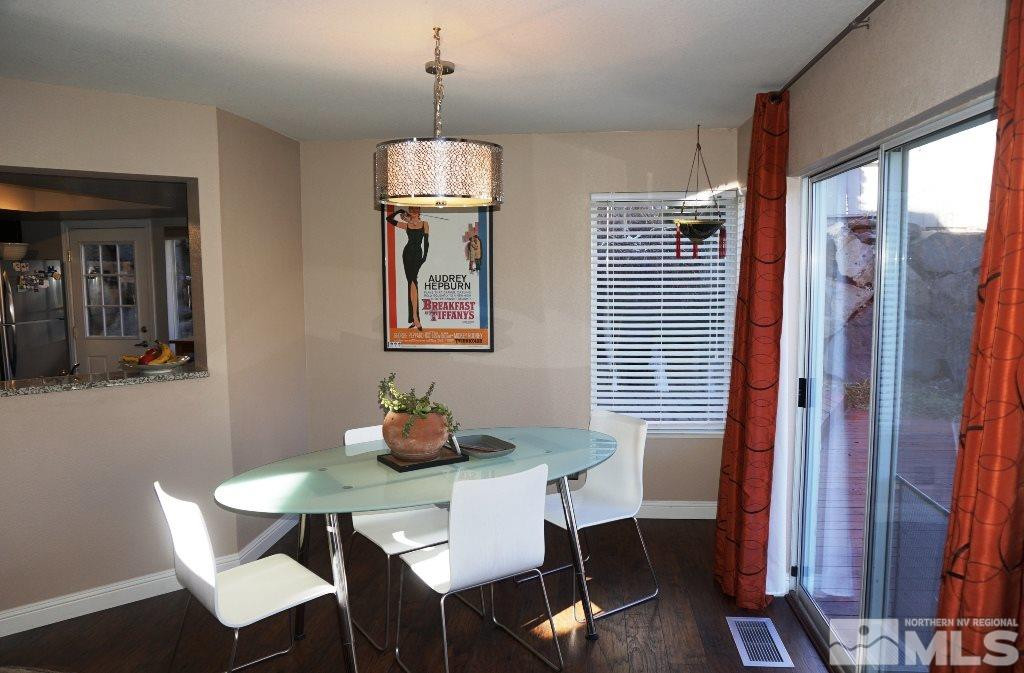 3005 Alpine Creek Road Reno, NV 89519 - Photo 13 of 25 a view of a dining room with furniture window and wooden floor