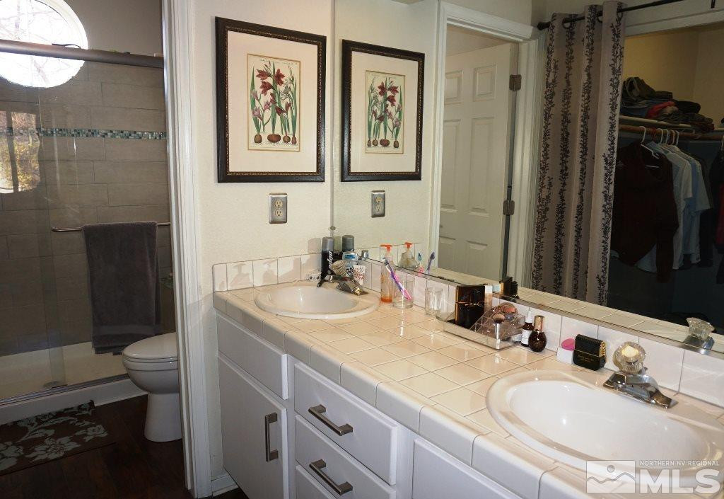 3005 Alpine Creek Road Reno, NV 89519 - Photo 17 of 25 a bathroom with a sink double vanity and a toilet