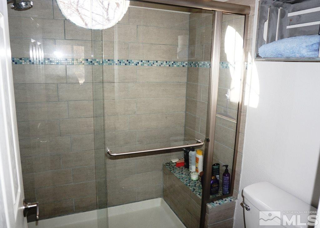 3005 Alpine Creek Road Reno, NV 89519 - Photo 18 of 25 a bathroom with a shower and a toilet