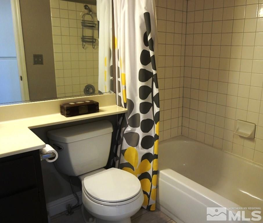 3005 Alpine Creek Road Reno, NV 89519 - Photo 19 of 25 a white toilet sitting next to a bathtub