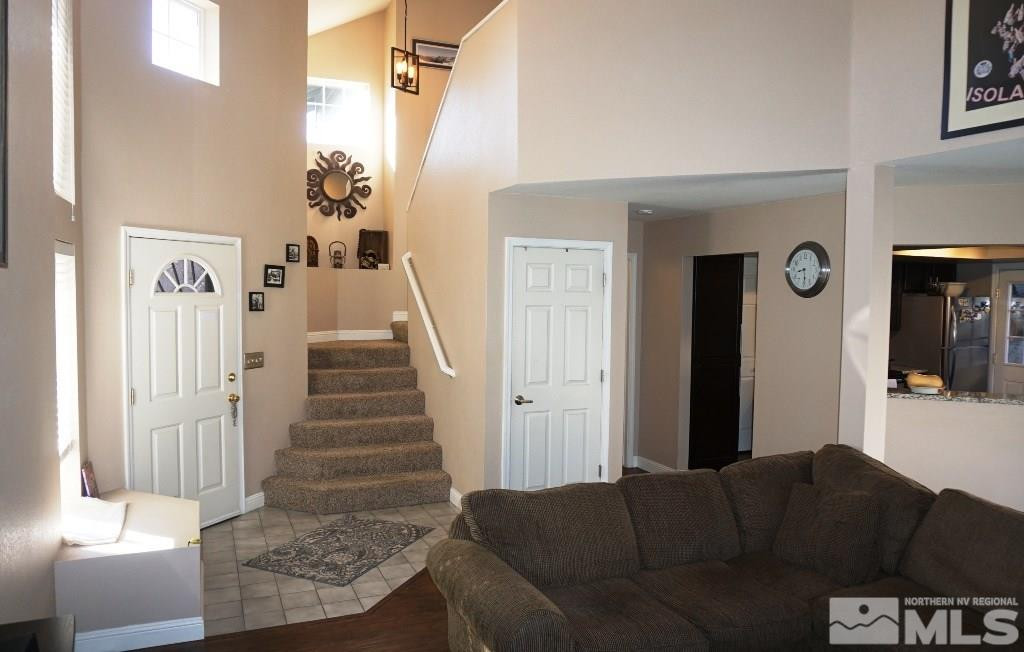 3005 Alpine Creek Road Reno, NV 89519 - Photo 4 of 25 a living room with furniture and a fireplace