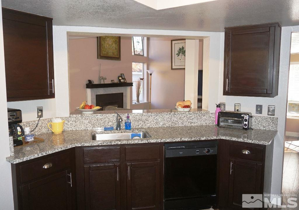 3005 Alpine Creek Road Reno, NV 89519 - Photo 9 of 25 a bathroom with a granite countertop double sink and a mirror