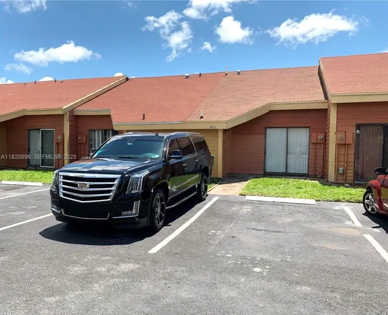a view of a car parked in front of a house