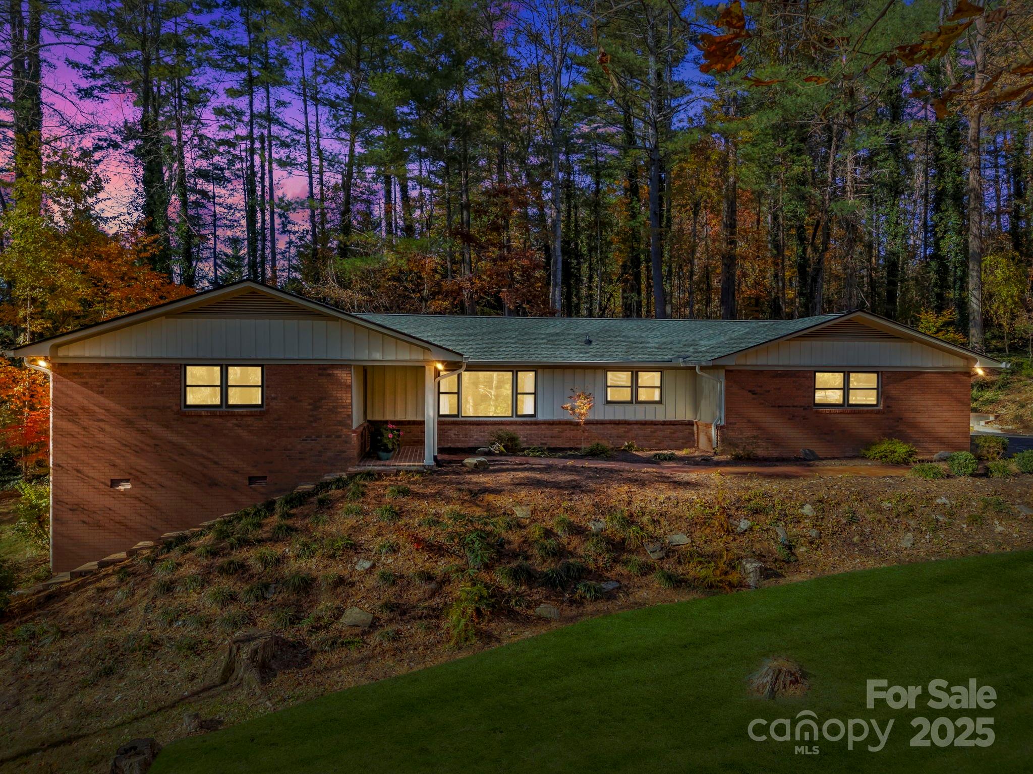 228 Raintree Drive Hendersonville, NC 28791 - Photo 1 of 37 a view of a house with a yard
