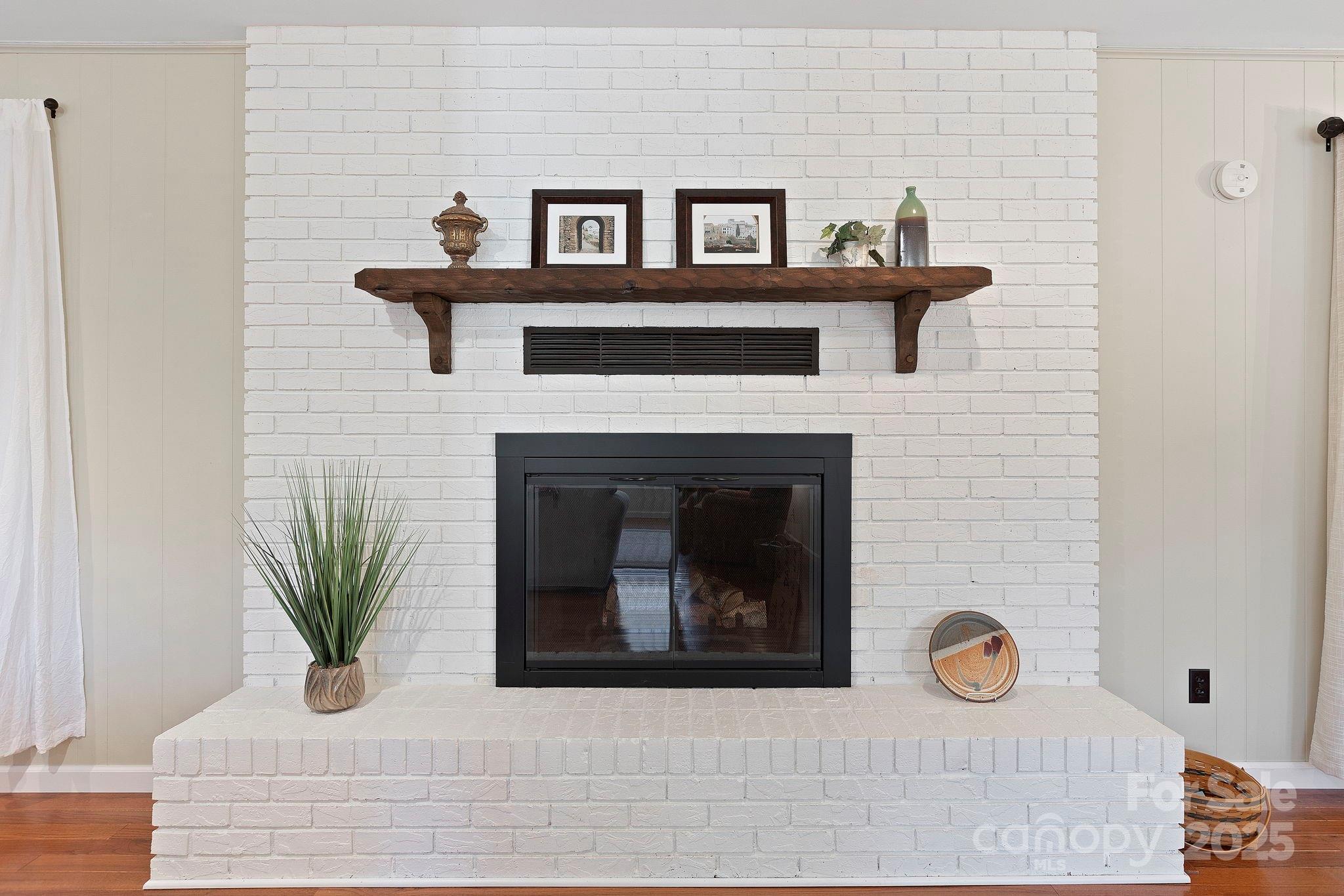 228 Raintree Drive Hendersonville, NC 28791 - Photo 11 of 37 a white house with sink and a fireplace