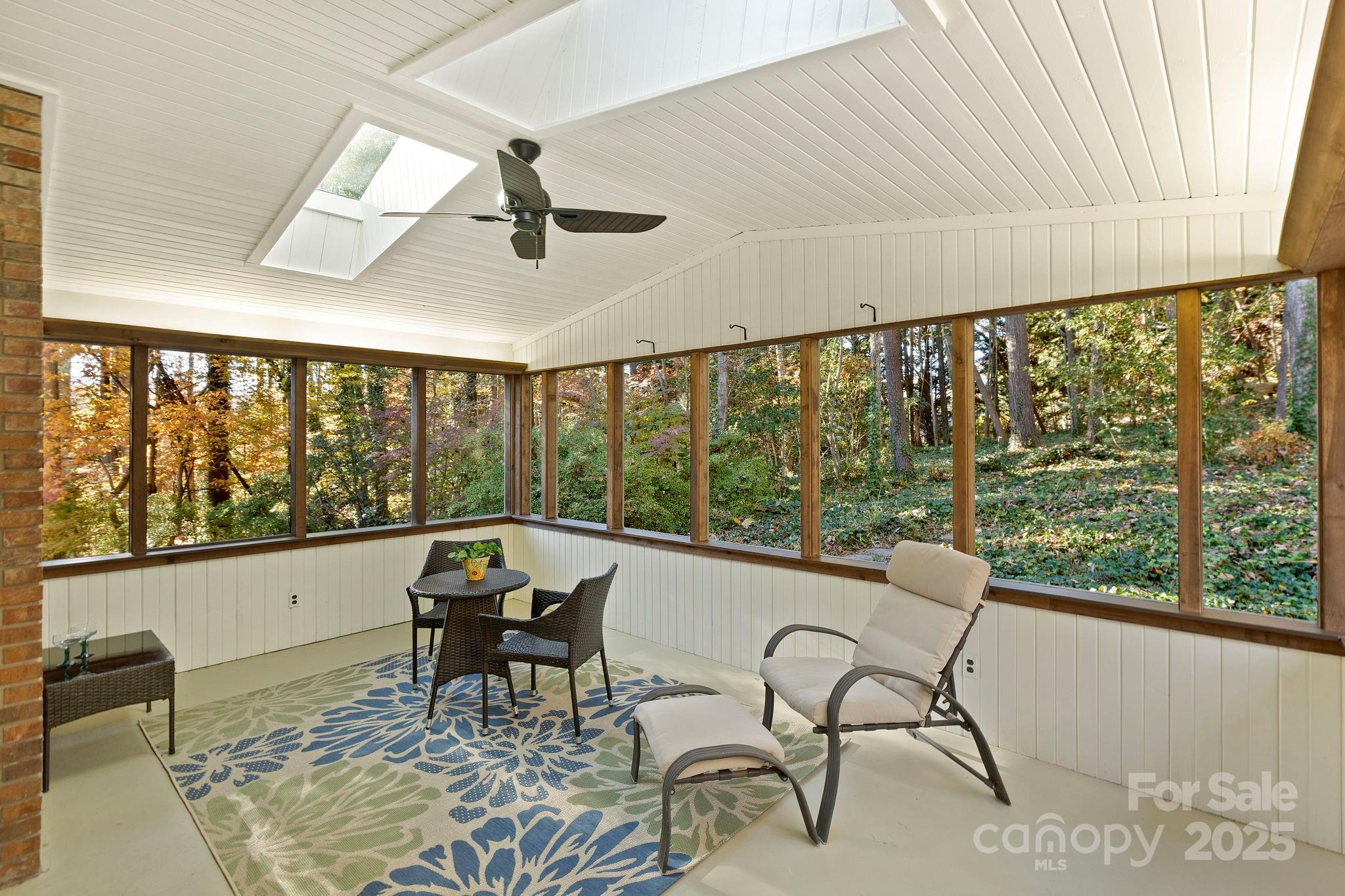 228 Raintree Drive Hendersonville, NC 28791 - Photo 18 of 37 a living room with furniture and a large window