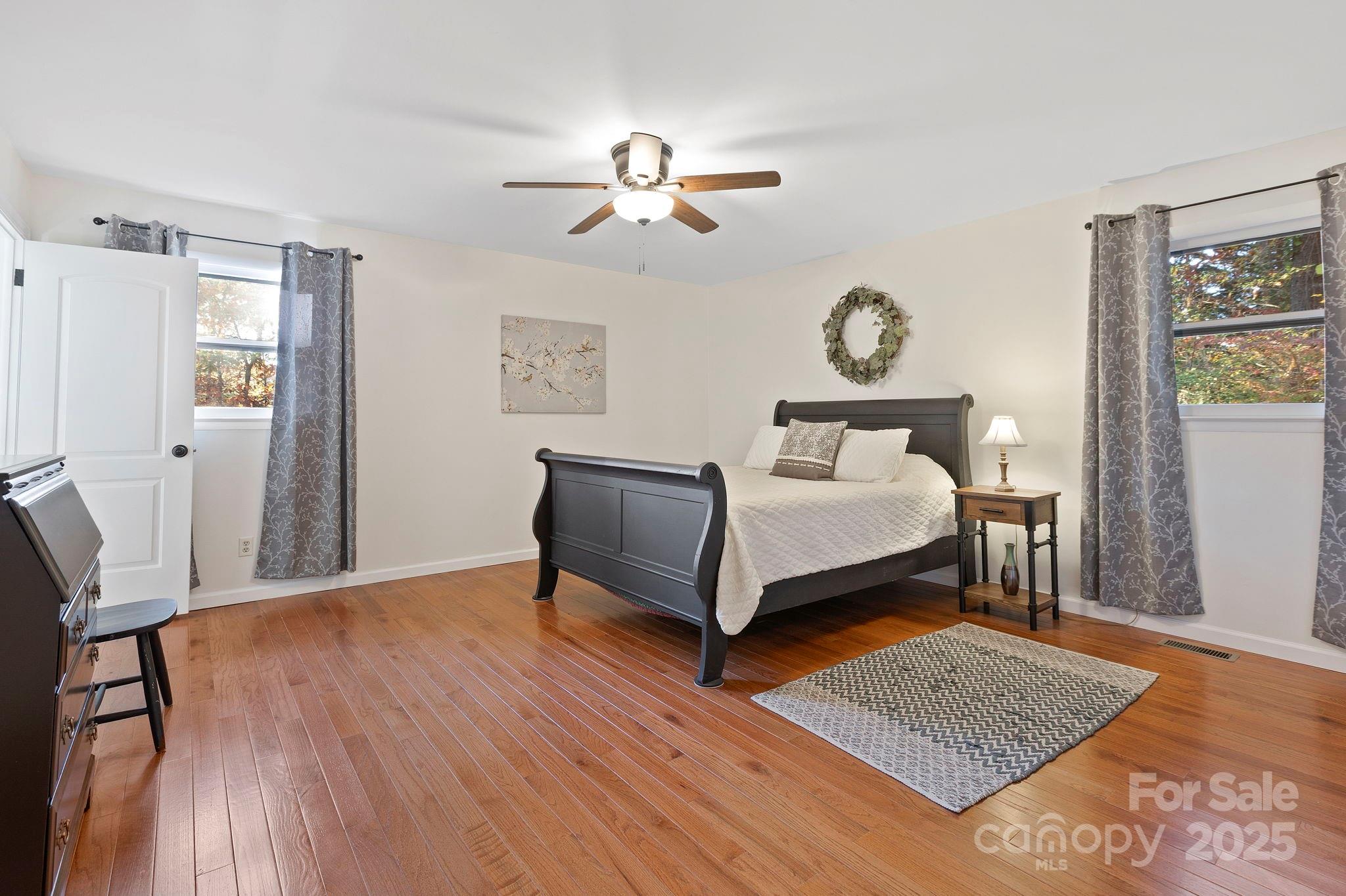 228 Raintree Drive Hendersonville, NC 28791 - Photo 20 of 37 a bedroom with a bed and a window