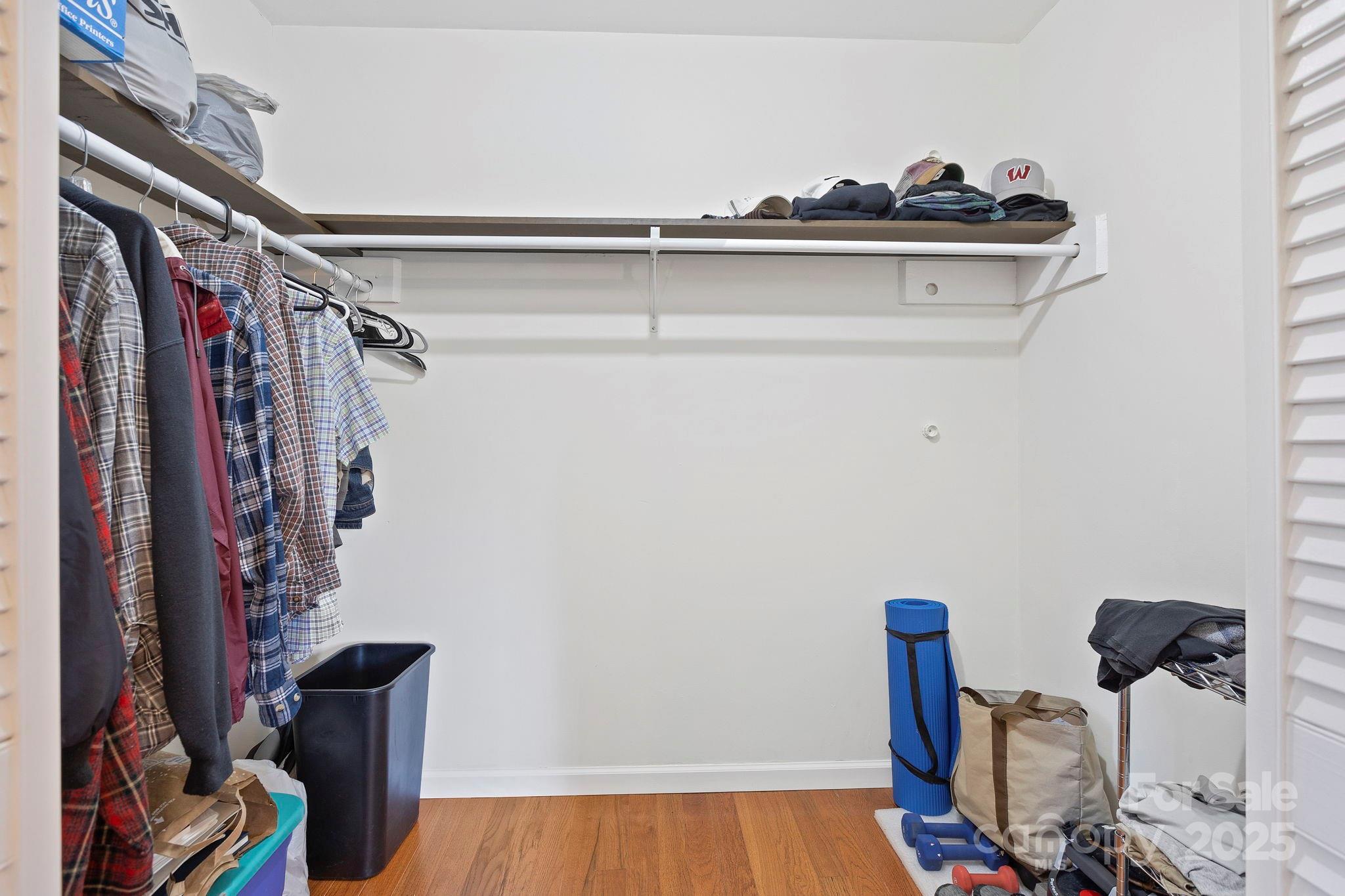 228 Raintree Drive Hendersonville, NC 28791 - Photo 24 of 37 a view of walk in closet with clothes and shoes