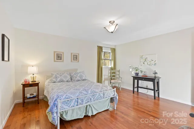 a bedroom with a bed and a table in it