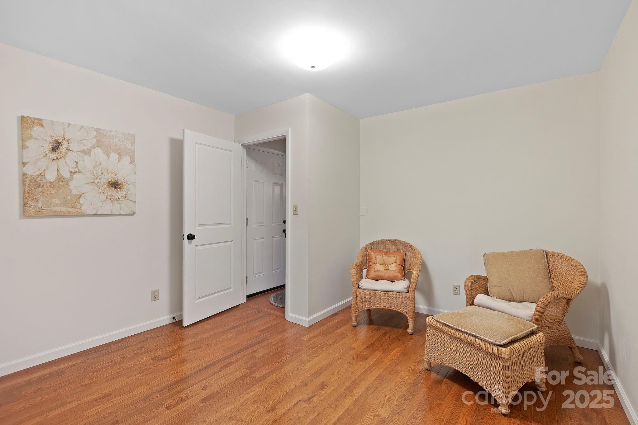 228 Raintree Drive Hendersonville, NC 28791 - Photo 29 of 37 a room with furniture and a wooden floor
