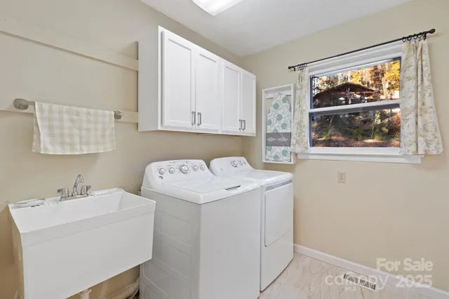 a utility room with dryer and washer