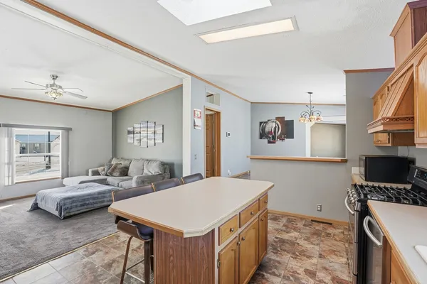 a view of a bedroom with furniture and window