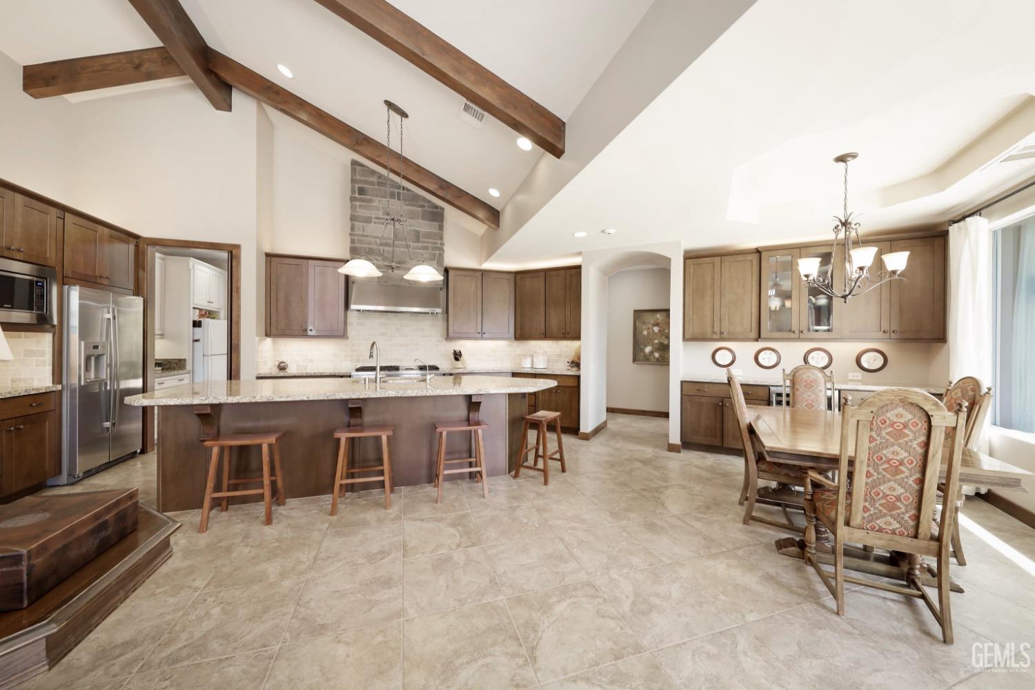 Undisclosed Address Bakersfield, CA 93308 - Photo 12 of 51 a large kitchen with a table and chairs