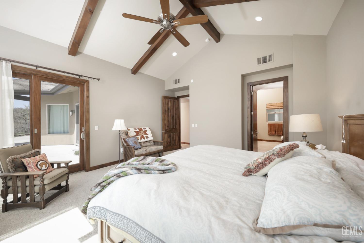 Undisclosed Address Bakersfield, CA 93308 - Photo 19 of 51 a bedroom with a bed mirror and window