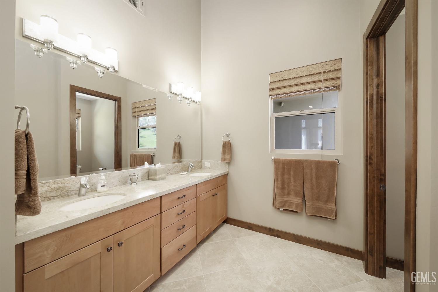 Undisclosed Address Bakersfield, CA 93308 - Photo 20 of 51 a bathroom with a granite countertop sink mirror and
