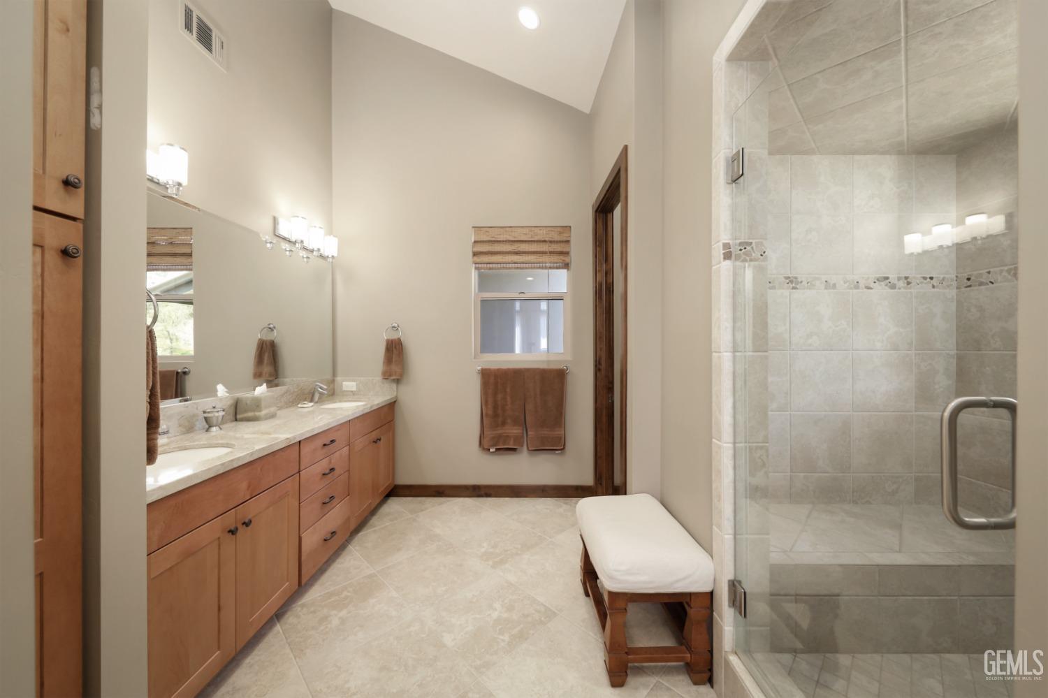 Undisclosed Address Bakersfield, CA 93308 - Photo 21 of 51 a bathroom with a granite countertop sink a toilet and shower